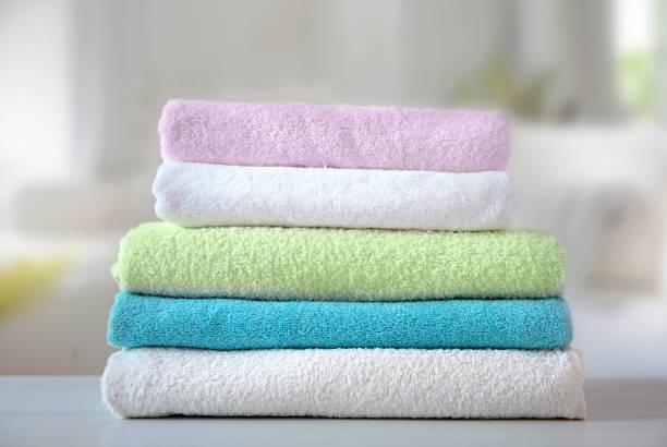 istock Colorful terry towels stack on table indoors. Bathroom shower items. Household. 1320141353