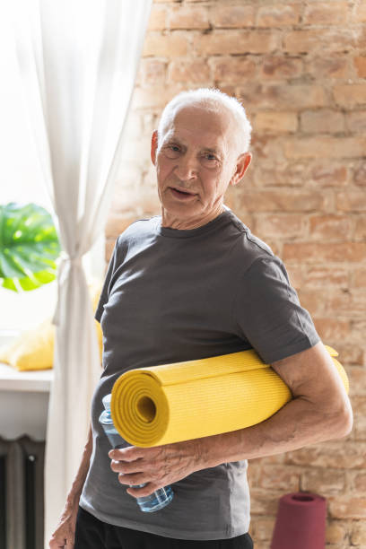 istock Active elderly man with is ready for his fitness workout at home 1320141357