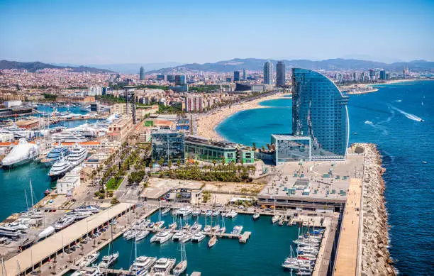 Front of Barcelona from the air with the port vell, the business center and the hotel