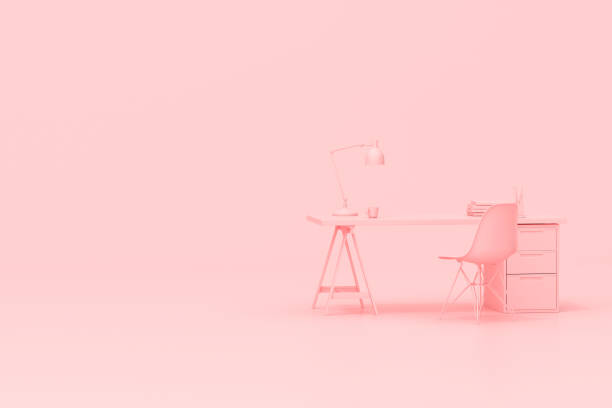 istock 3d rendering of workspace desk table with office accessories on pink background. 1320142342