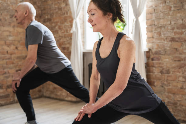 istock Two elderly people during fitness workout at home 1320142372