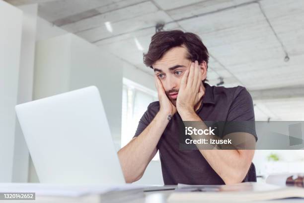 Overworked Man In The Office Stock Photo - Download Image Now - Men, Tired, Laptop