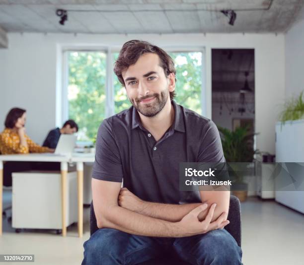 Portrait Of Man In The Office Stock Photo - Download Image Now - Polo Shirt, Men, Occupation