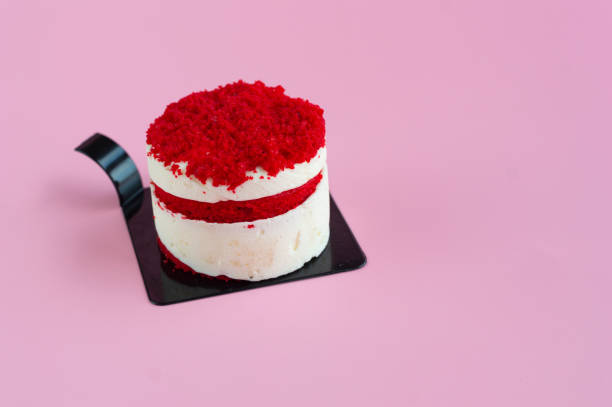 Delicious red velvet cake. Small strawberry and yogurt cake on a pink background.