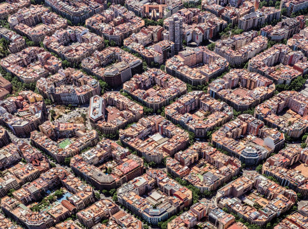 Aerial view of the residential Eixample district of Barcelona Aerial view of typical buildings of Barcelona cityscape from helicopter. top view, Eixample residencial famous urban grid helicopter point of view photos stock pictures, royalty-free photos & images
