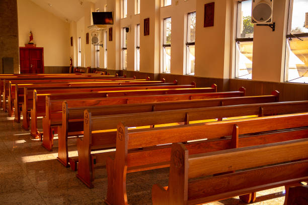 istock Rows of wooden chairs inside a church. 1320144038