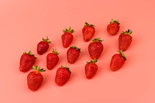 istock Strawberries on pink background. Strawberries berries pattern. Creative food concept. Flat lay, top view, copy space 1320145449