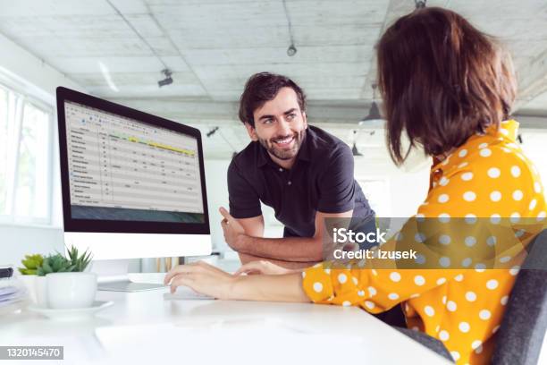 Coworkers In The Office Stock Photo - Download Image Now - Two People, Business, Computer Monitor