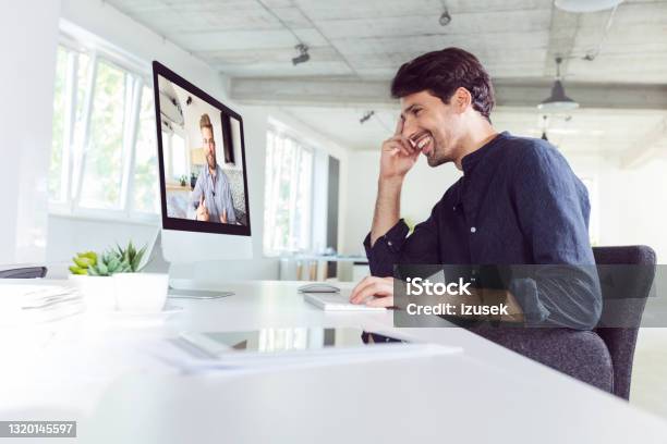 Man During Video Conference Stock Photo - Download Image Now - Desk, Webcam, Computer Monitor