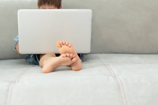 istock Kids and gadgets. Distance learning and virtual communication on isolation  quarantine in coronavirus. online chat. Boy and laptop at home. Lifestyle 1320146681