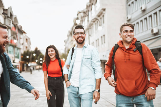 istock Smiling Friends Taking A Stroll Through City Center Together 1320146776