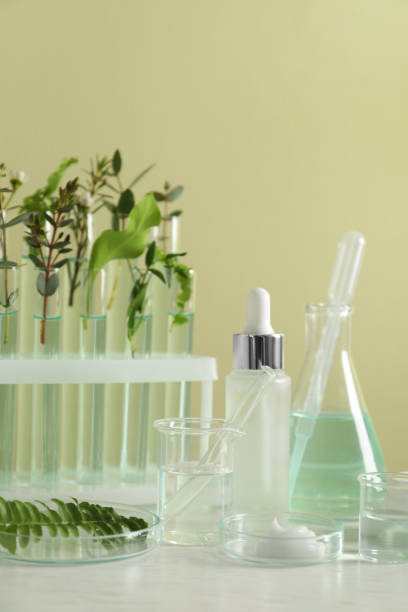istock Natural ingredients for cosmetic products and laboratory glassware on white table 1320146916
