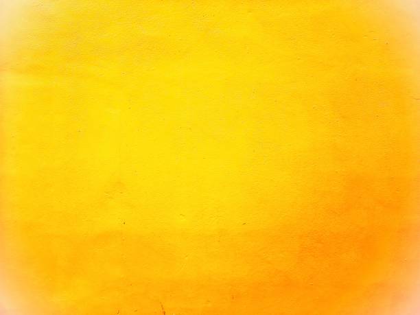 istock Abstract​ yellow​ and​ orange​ color​ background​ cement​ wall 1320147150