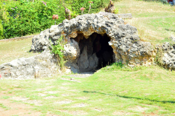 istock cave on the grass hill photo 1320148016