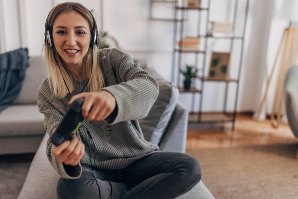 istock Woman playing video games 1320149252