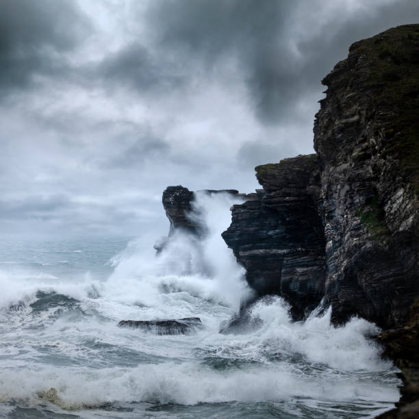 250ft cliffs covered by waves