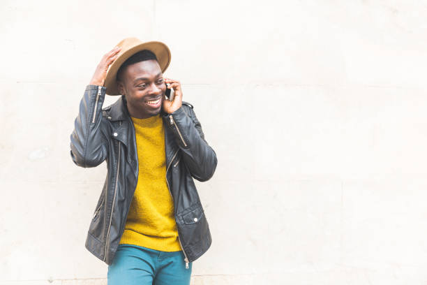 Happy black man talking on the phone and smiling