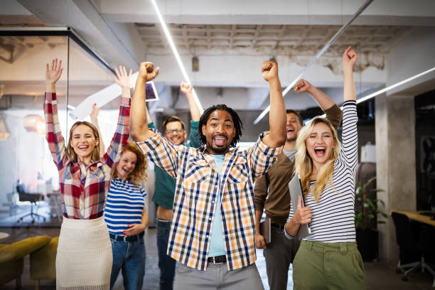 istock Successful company with happy employees in modern office 1320153647