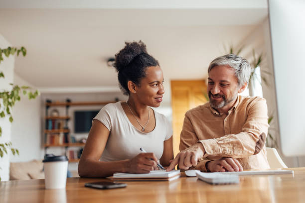 istock Business couple, woman and man, doing some paperwork. 1320153780