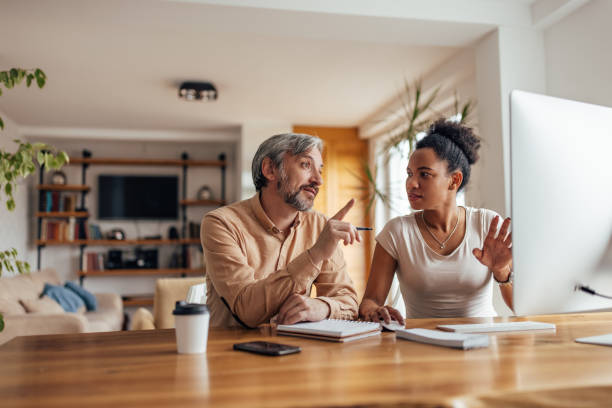 istock African woman, helping her partner to understand something. 1320153783