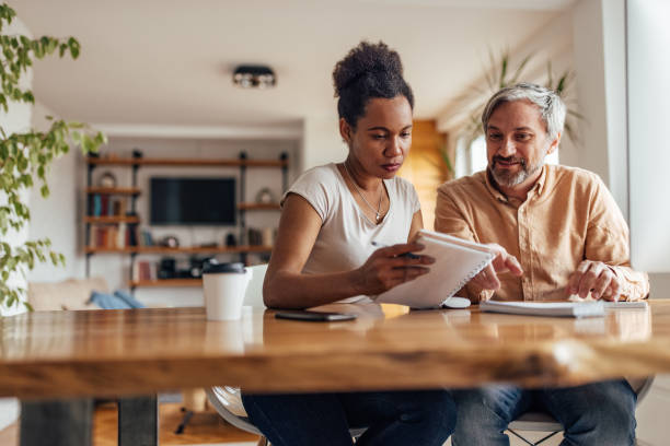 istock African wife explaining her business plan to her husband. 1320153786