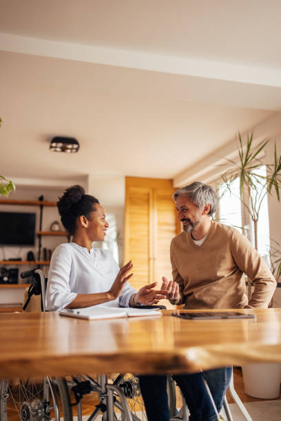 istock Disabled woman enjoying with her husband, at home. 1320153804