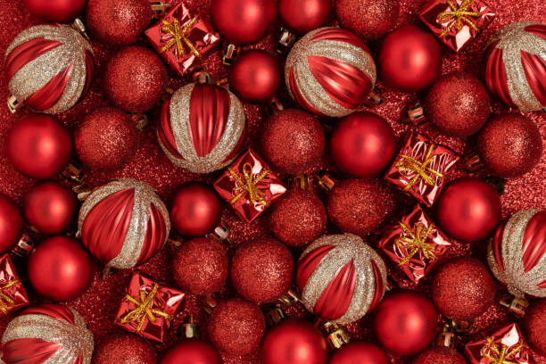istock Christmas toys on a red glittering background. 1320155101