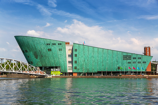 Amsterdam, Netherlands - 7th July 2014: The Nemo Science Museum on the waterfront and located in the Oosterdokseiland neighbourhood. Designed by Renzo Piano and opened in 1997.