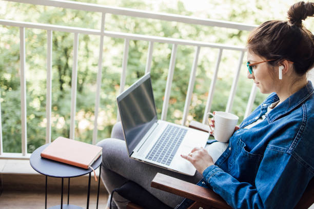 istock Young entrepreneur enjoying her online work from the balcony 1320157034