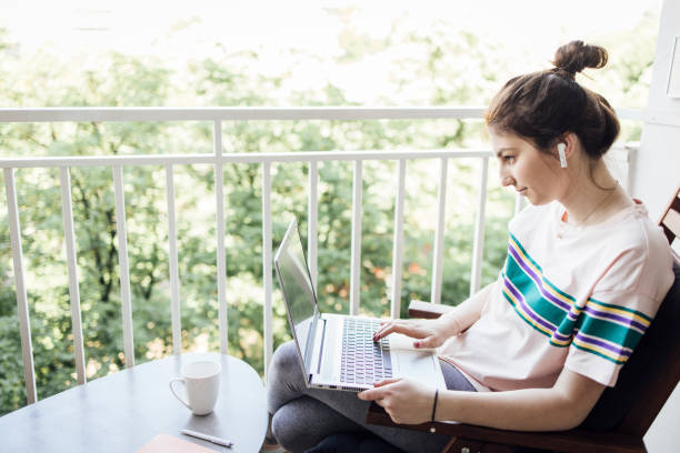 istock Young manager working online from her home balcony 1320157043