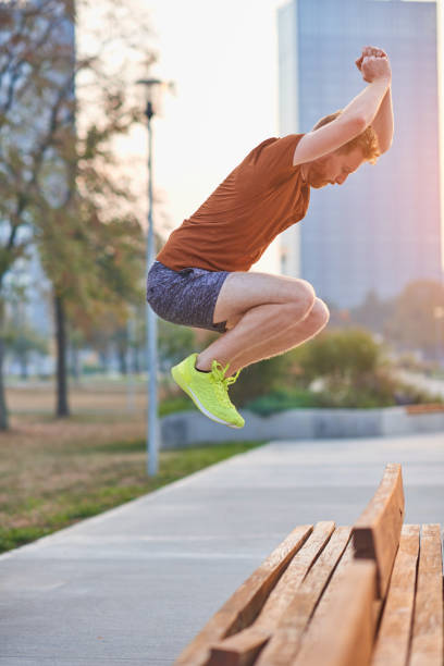 istock Young sporty man exercising in urban park. 1320157861