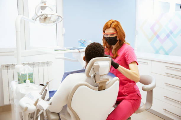 istock Young African-American man at dental office 1320158358