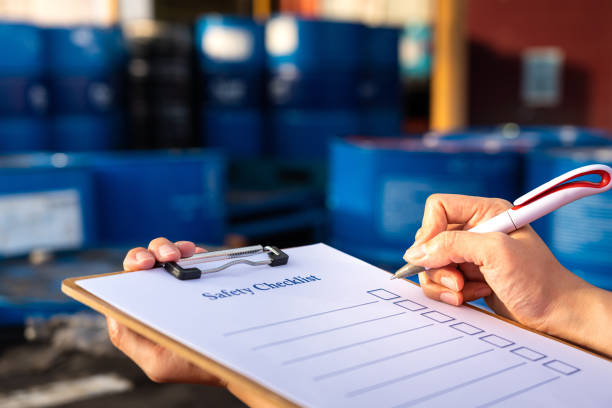 istock Action of worker hand is using a pen to do safety checkilist. 1320159177
