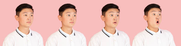 istock Asian man's portrait isolated over pink studio background with copyspace. Evolution of emotions. 1320159348