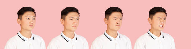 istock Asian man's portrait isolated over pink studio background with copyspace. Evolution of emotions. 1320159350