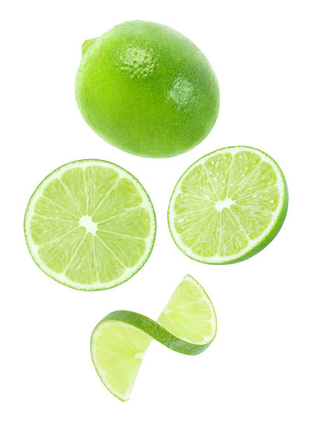 istock Lime whole and cut pieces falling, hanging, flying, soaring, isolated on white background, element of packaging design. Full depth of field. 1320159809