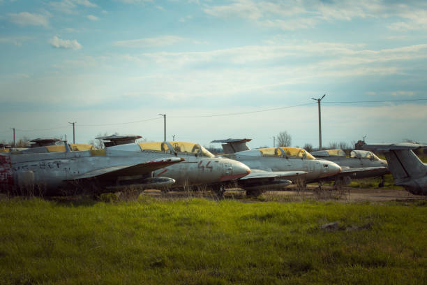 istock Old Soviet military aircraft standing at the airfield. Rusty used technique 1320161458