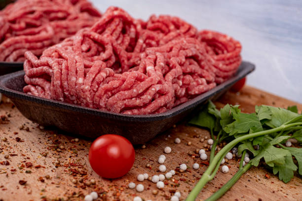 istock Minced meat in a tray with tomatoes, garlic, parsley and pepper 1320162376
