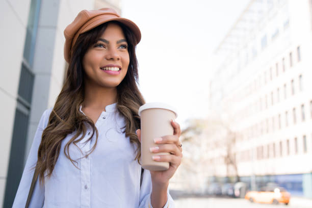 istock Young woman holding a cup of coffee. 1320162680