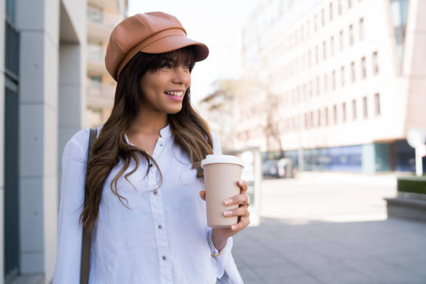 istock Young woman holding a cup of coffee. 1320162690