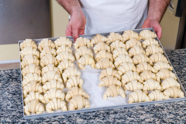istock Pastry chef prepares jam croissants 1320163660