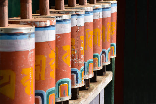 istock Orange color prayer wheels with prayer inscriptions. 1320163804