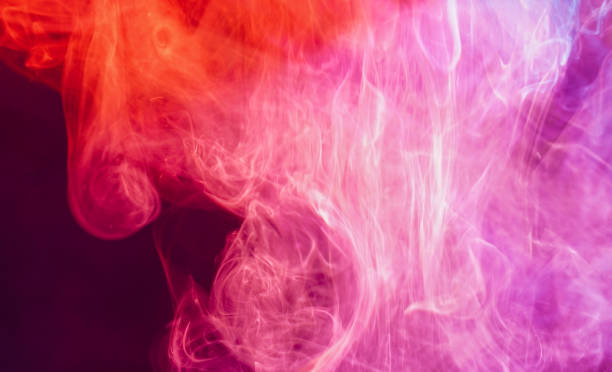 istock Smoke from an incense stick with color foils Photographed in the studio 1320165430