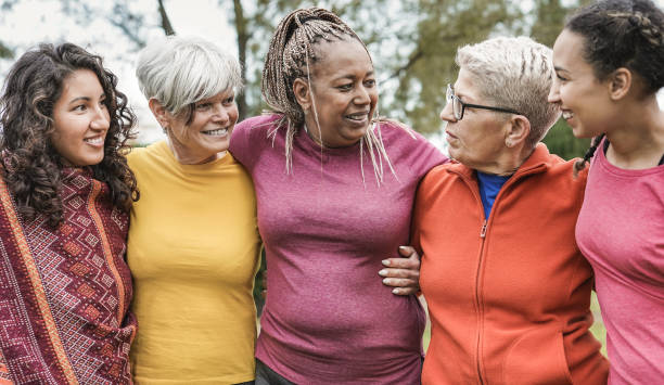 istock Cheerful multi generational women having fun at city park while hugging each other - Multiracial people meeting each other outdoor 1320165626