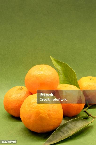 Mandarins On A Green Background Stock Photo - Download Image Now - Color Image, Germany, No People
