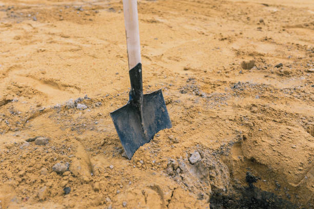 istock Shovel in the sand. Tool for construction work and work on the land. Planting trees and plants 1320166844