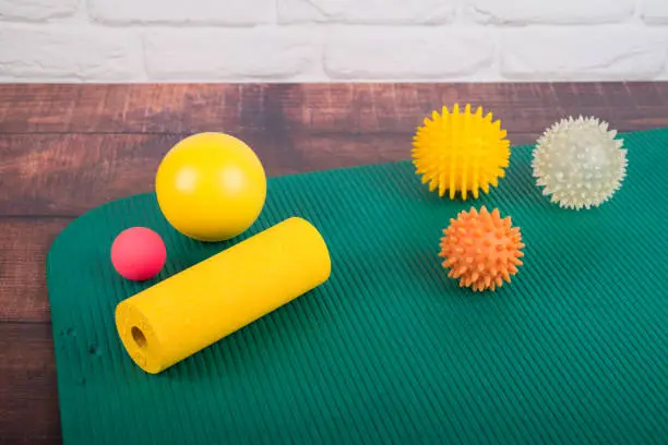 Mat with massage balls and equipment for fascia training