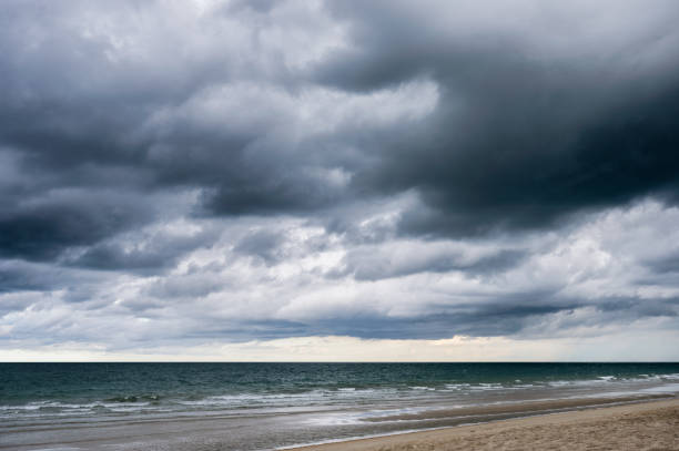 istock Dark dramatic sky and stormy clouds over the sea 1320167250