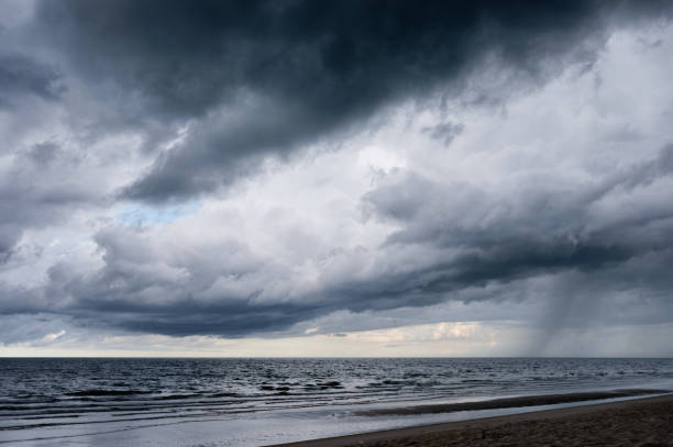 istock Dark dramatic sky and stormy clouds over the sea 1320167252