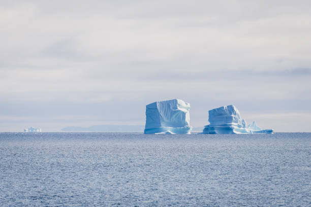 Northern Icebergs Polar ice caps are melting at a fast speed. This picture symbolizes both the effects of climate change and a peaceful image of relaxation. antarctic ocean photos stock pictures, royalty-free photos & images